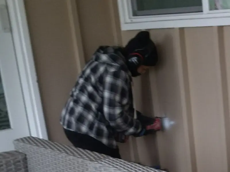 Professional electrician installing an exterior outlet in Spring Garden