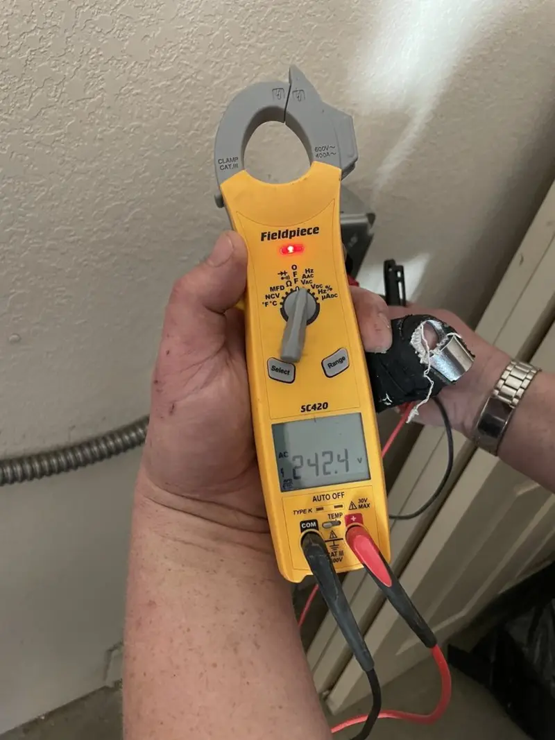 Voltage testing with clamp meter during Whole House Surge Protector in Spring Garden